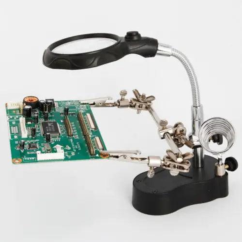 PHONEFIX LED magnifier soldering iron stand with built-in magnifying glass for precision soldering and assistance.