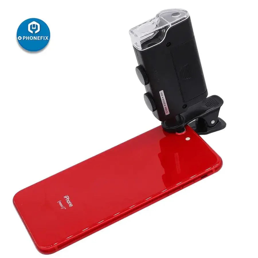PHONEFIX Mini Phone Clip Microscope with 60X magnification, LED and UV light, used as a soldering magnifying glass for detailed work.