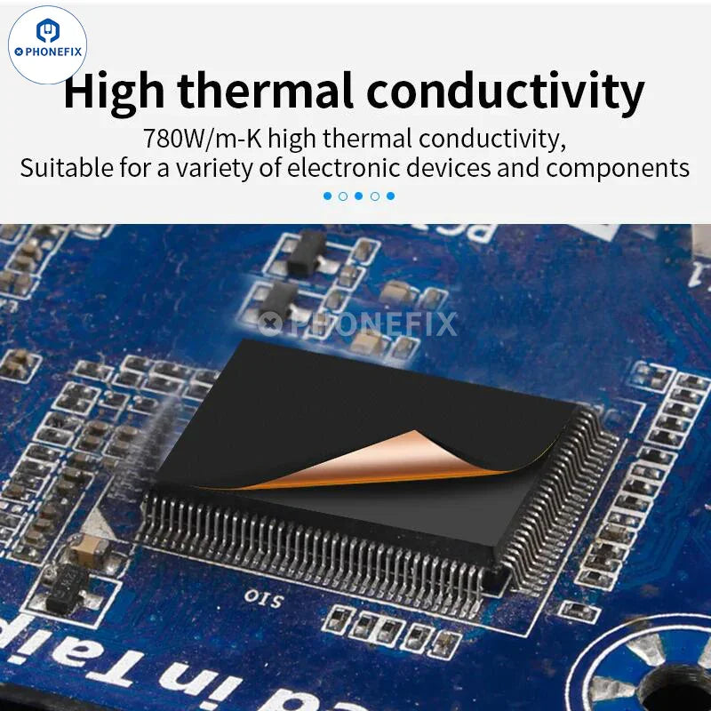 Graphene heatsink thermal pad for phone CPU cooling, shown on a soldering mat by PHONEFIX.
