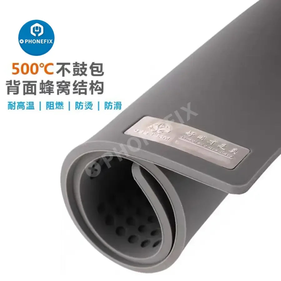 Large dark blue PHONEFIX OSS TEAM soldering silicone mat with high-temperature resistance for electronics work and heat protection.
