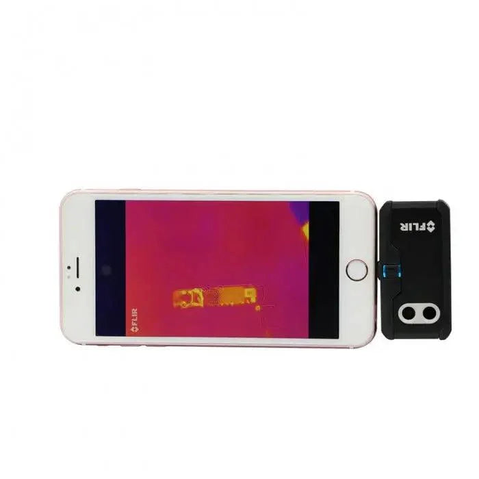 FLIR ONE PRO thermal imaging camera by PHONEFIX showing PCB board with thermal hotspots for fault diagnosis.