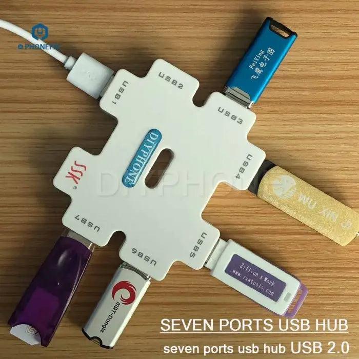 PHONEFIX SSK SHU011 USB hub power splitter with 7 ports, USB extender and port tester, connected to multiple USB devices.