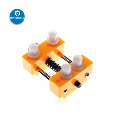 Adjustable PHONEFIX watch repair tool with screws for opening watch back covers and case removal.
