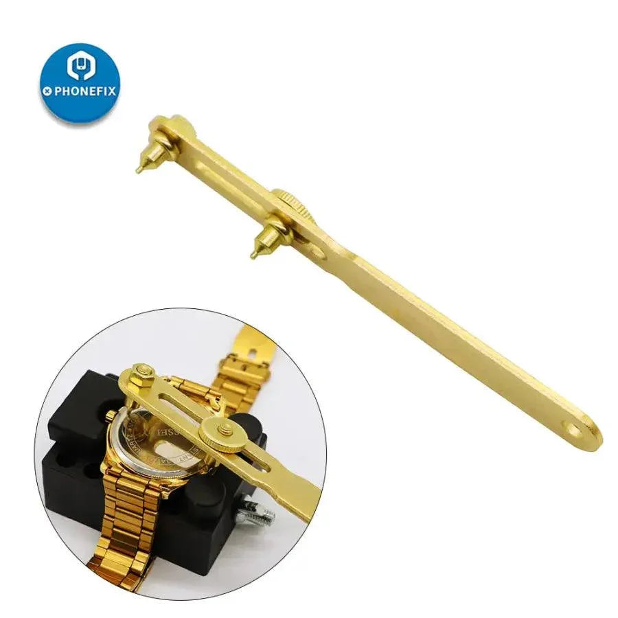 Gold PhoneFix two-claw screw watch back case opener tool for watchmaker repairs, designed for easy watch case removal.