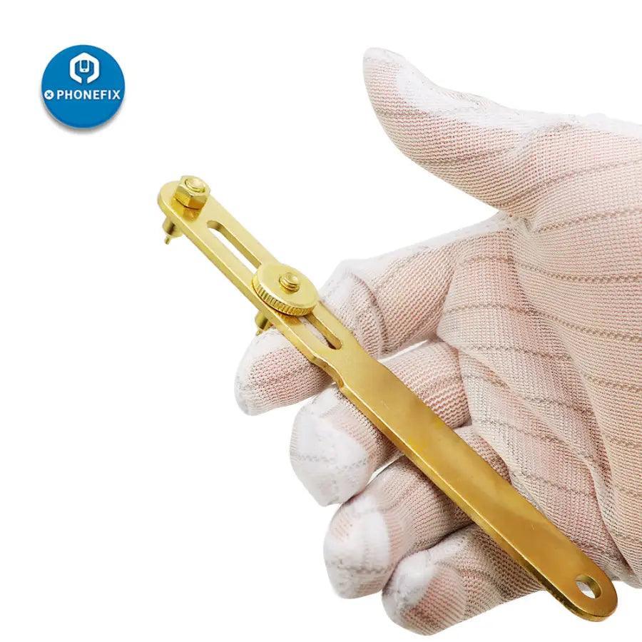 Gold two-claw screw watch back case opener tool for watch repair by PHONEFIX, with ergonomic design for watchmaker use.