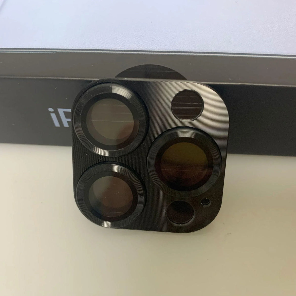 Silver tempered glass rear camera lens protector for iPhone 13-14 Pro Max, designed to shield the back camera from scratches.